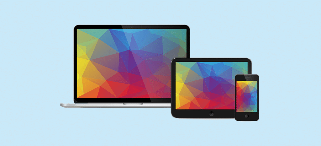 a laptop, a tablet, and a phone, each displaying the same theme