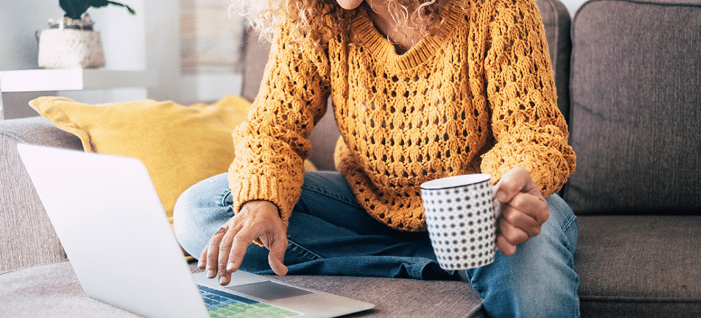 a woman in a yellow sweatshirt works on a multisite