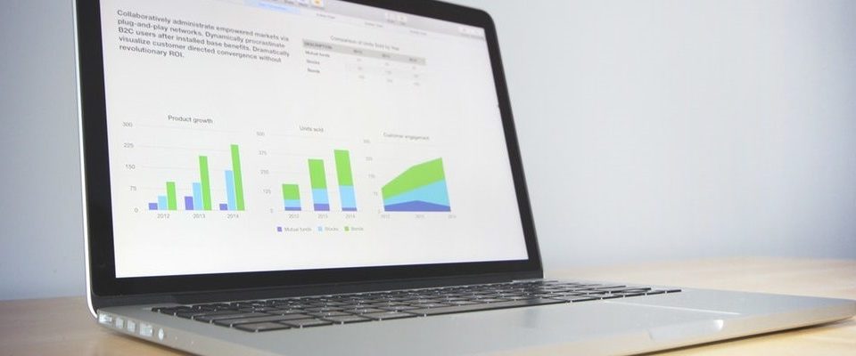 WordPress Plugins for Data Visualization and BI Reports. a computer showing charts that display site data. Wordpress Data Visualization Plugin