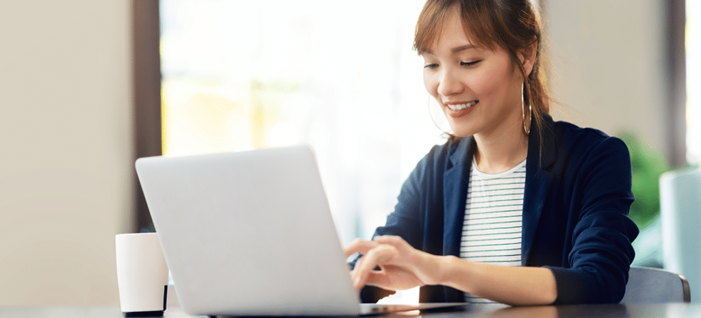 a woman uses cPanel on a laptop