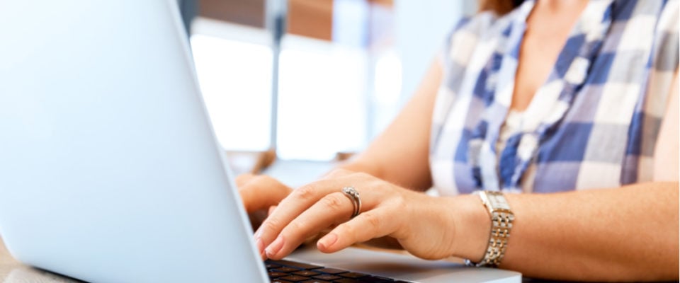 woman typing on laptop