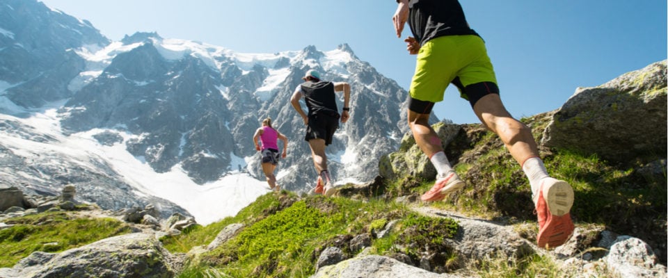 Image of people trail running up a mountain
