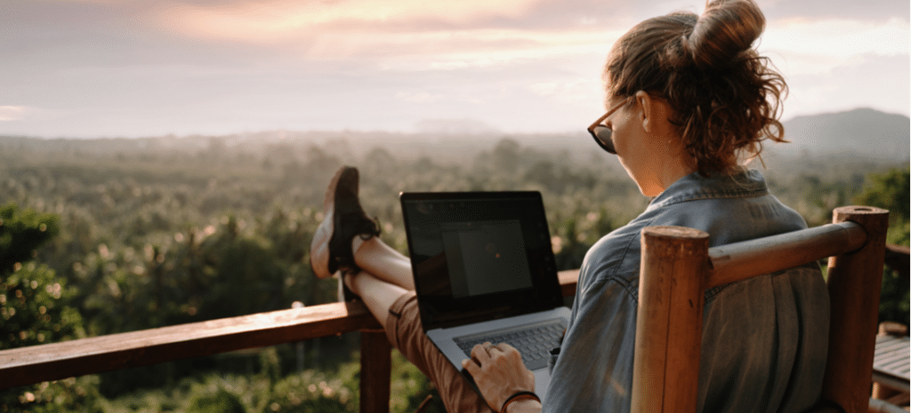 Woman using laptop on deck WordPress design. WordPress bootstrap