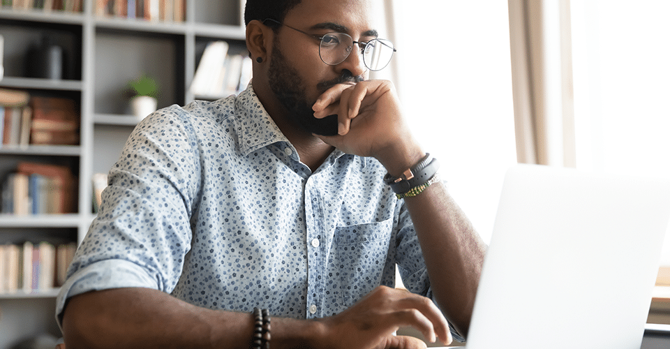 a man works on a laptop