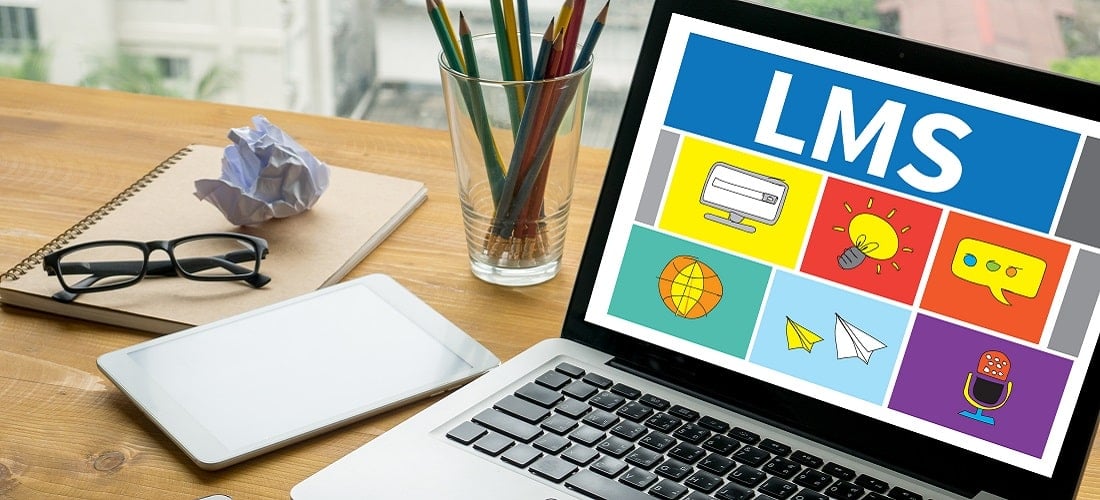 Laptop on table with LMS open