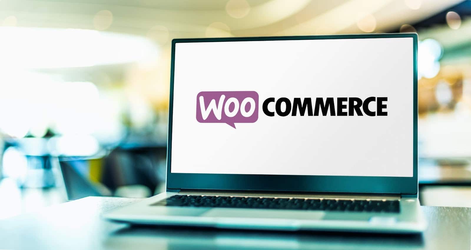WooCommerce logo on laptop screen
