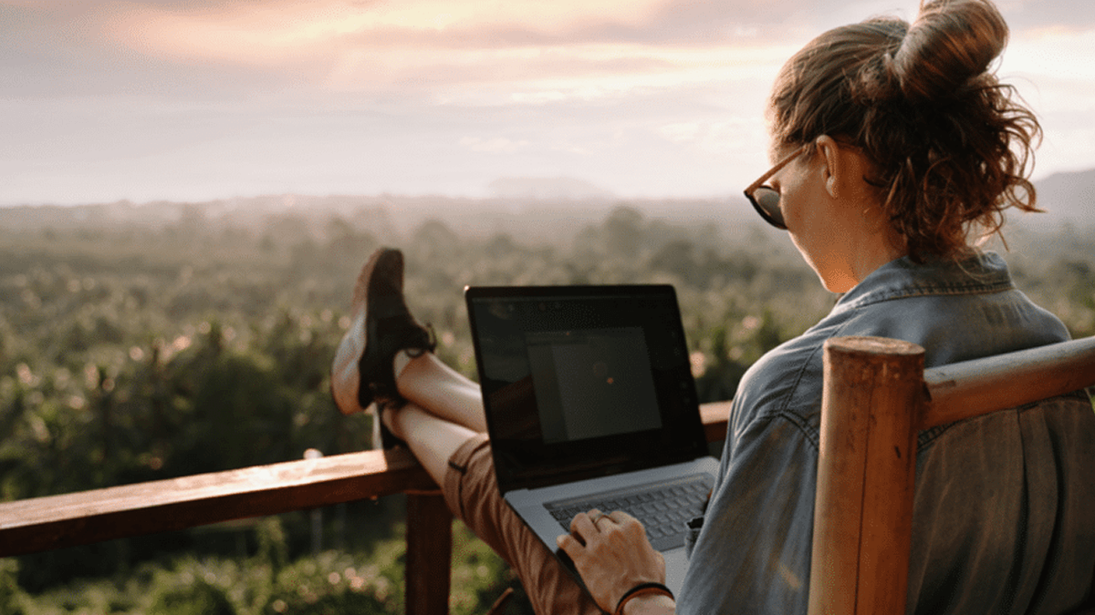 Woman using laptop on deck WordPress design. WordPress bootstrap