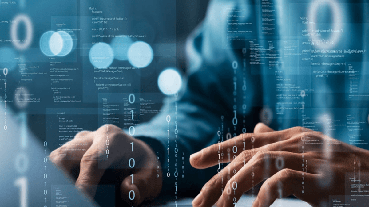 Man typing on laptop keyboard with obscure code overlay 2